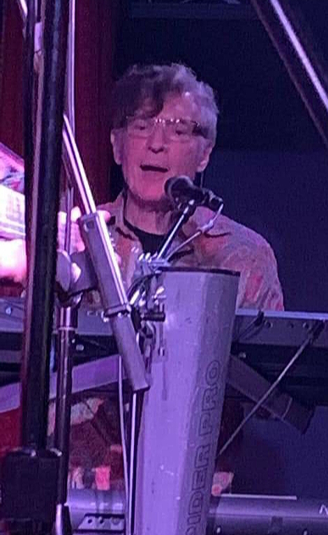 john lennon tribute band member on keyboard
